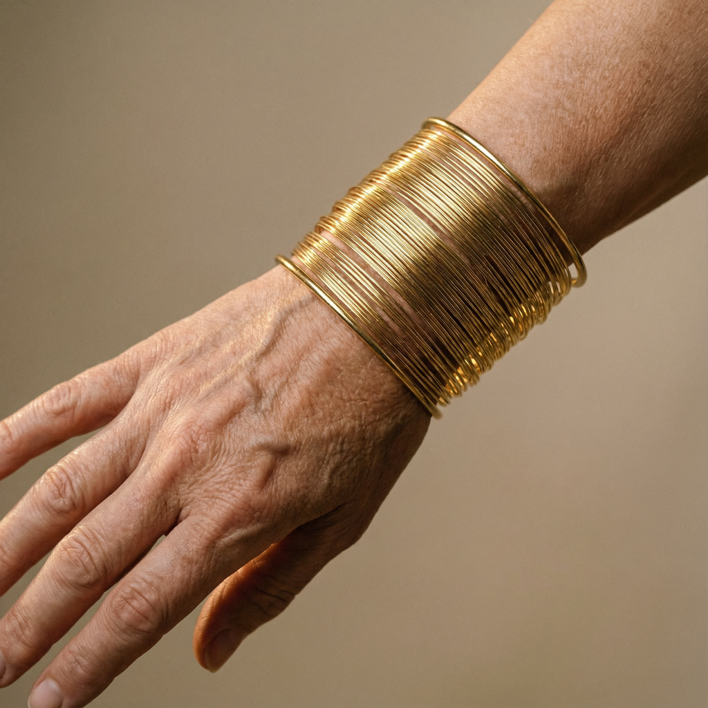 Nyitott arany spirál karkötő